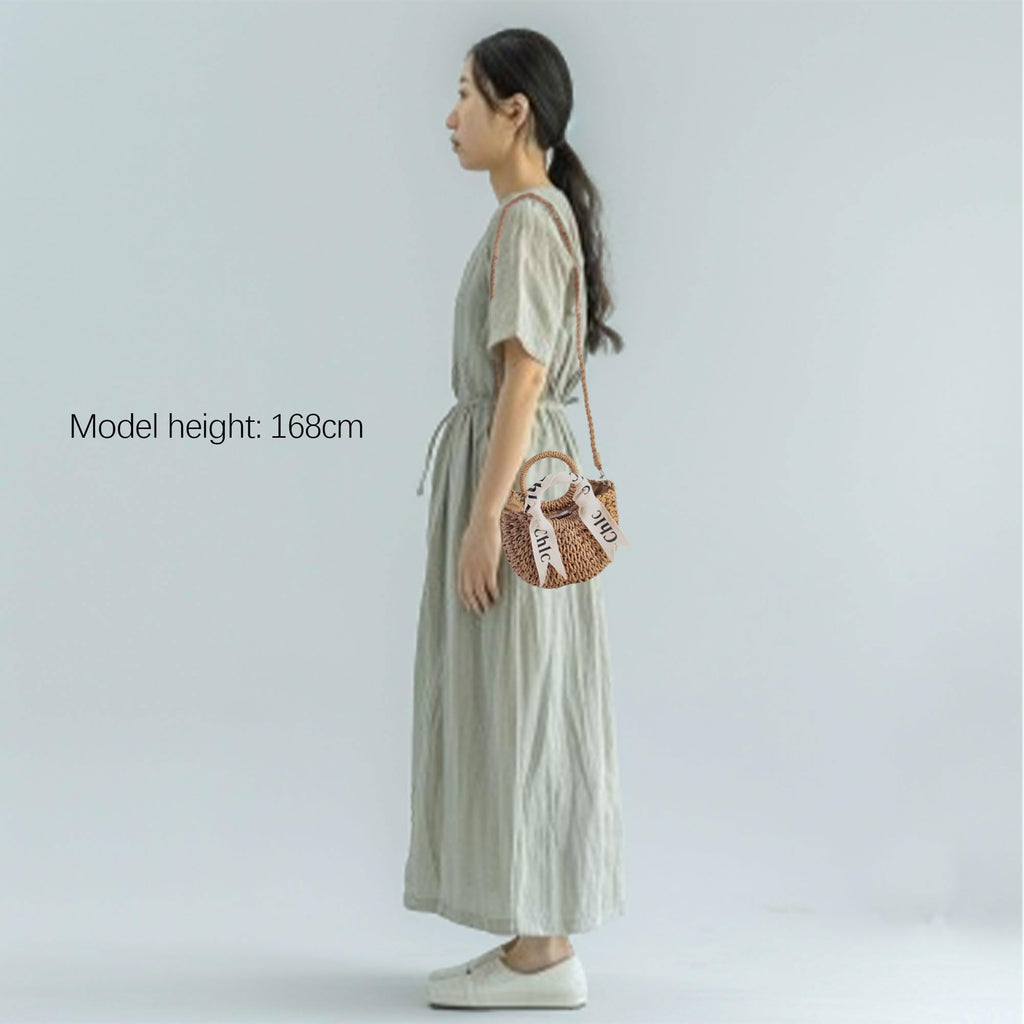 Eiyye off-white woven straw beach bag with shoulder straps, perfect for summer outings and stylish beach trips.