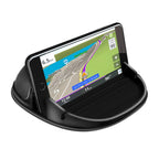 Black Loncaster car phone holder on a dashboard, securely holding an iPhone and GPS devices with a slip-free silicone design.