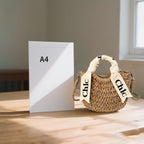 Eiyye off-white woven tote purse, perfect for summer beach outings, showcasing a stylish straw design and shoulder straps.