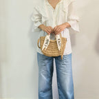 Eiyye off-white woven tote purse, perfect for summer beach outings, featuring a stylish shoulder design.