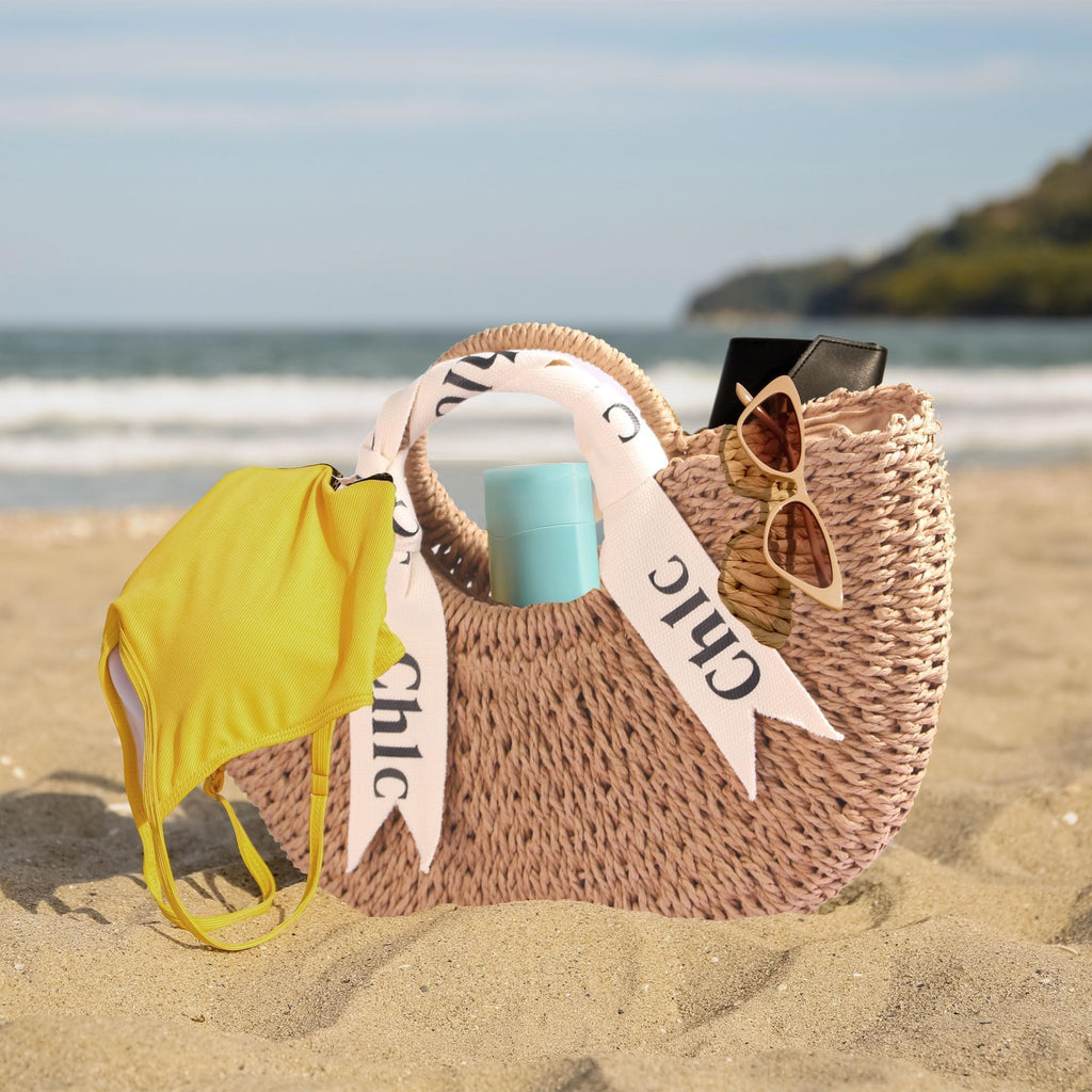 Eiyye off-white woven tote purse, perfect for summer beach outings, featuring a stylish shoulder strap and straw design.