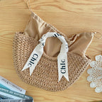 Eiyye women's off-white woven straw beach bag, stylish shoulder handbag perfect for summer outings.